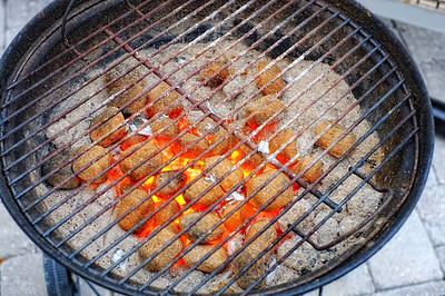 Buy stock photo Outdoor, flame and charcoal for barbecue on grill, burning and fire with embers for smoke in picnic. Backyard, dinner and appliance for lunch, roast and food with meat of steak on grid for cooking