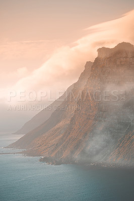 Buy stock photo Mountain, fog and ocean landscape with cliff, cloudy sky and tropical island sunset for travel location. Nature, sea and sustainable environment with earth, natural hill and holiday destination.