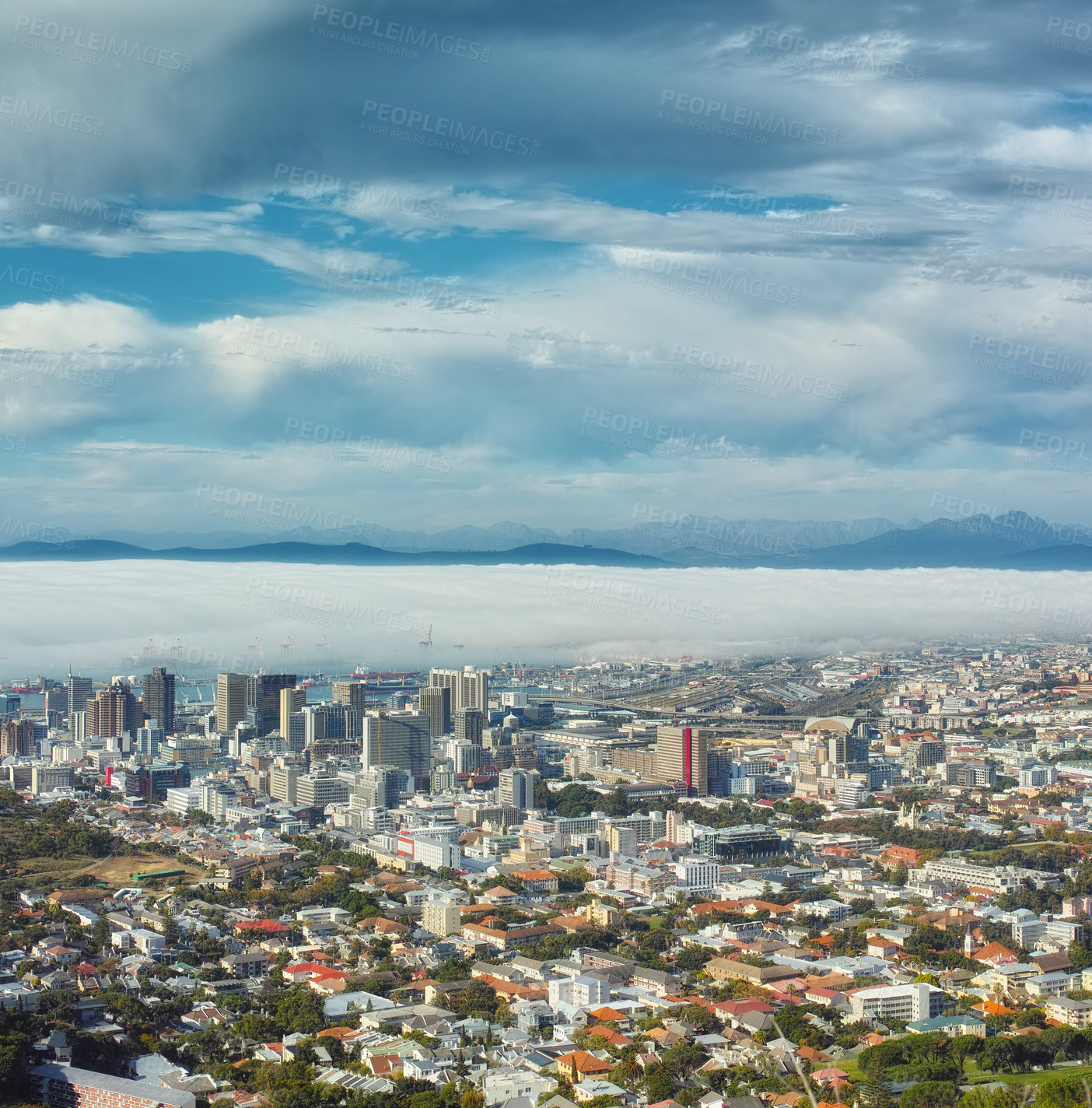 Buy stock photo A view of Cape town from the mountain while clouds roll in