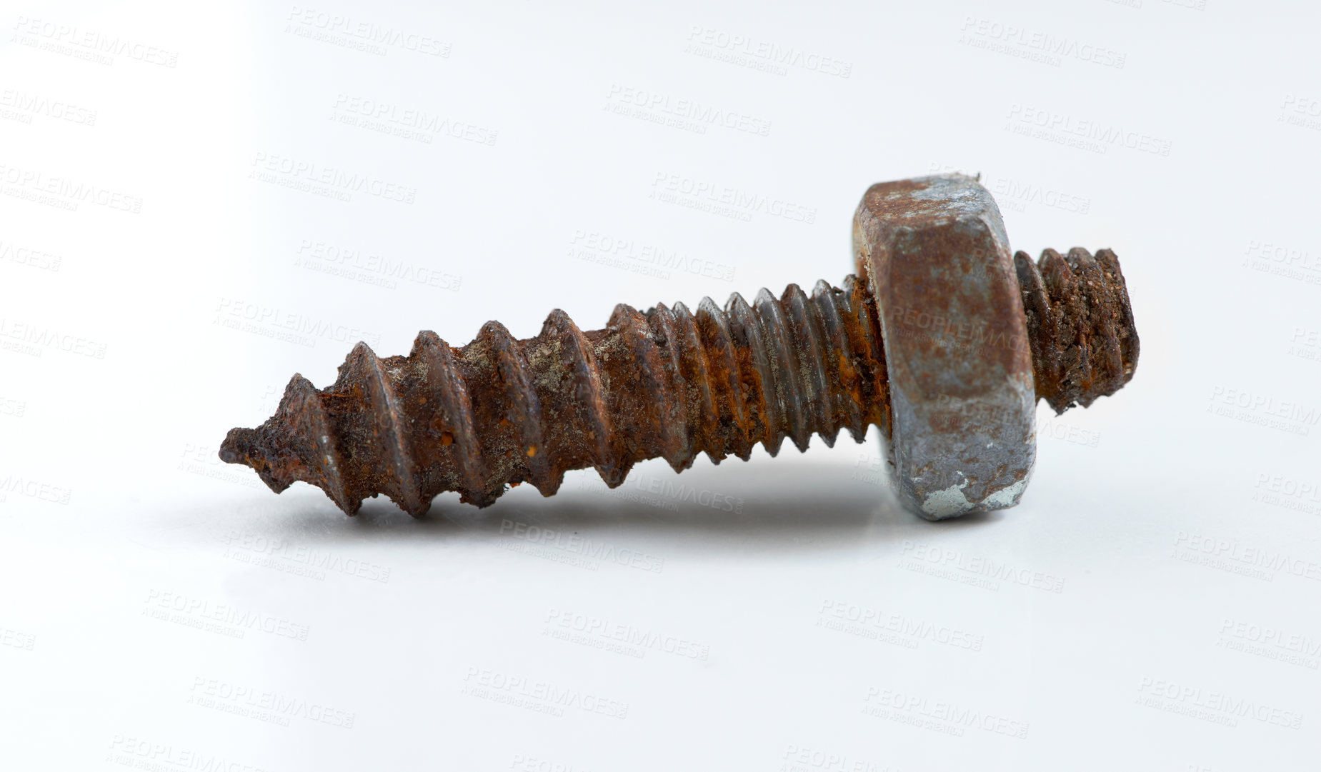 Buy stock photo A rusty screw lying against a white background