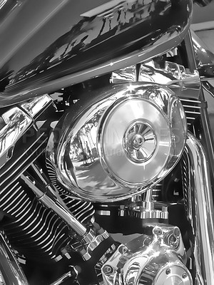 Buy stock photo Closeup of metallic motorcycle engine details. A classic, shiny chrome motorbike engine at a motorcycle repair shop. Zoom in on a silver design, black motorbike during annual service at a garage 