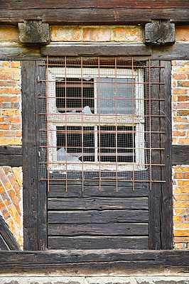 Buy stock photo Old, broken window and exterior with cage or brick wall of abandoned house, building or wooden frame. Historic outdoor bunker of rubble, glass crack or damage from war wreck, destruction or vandalism