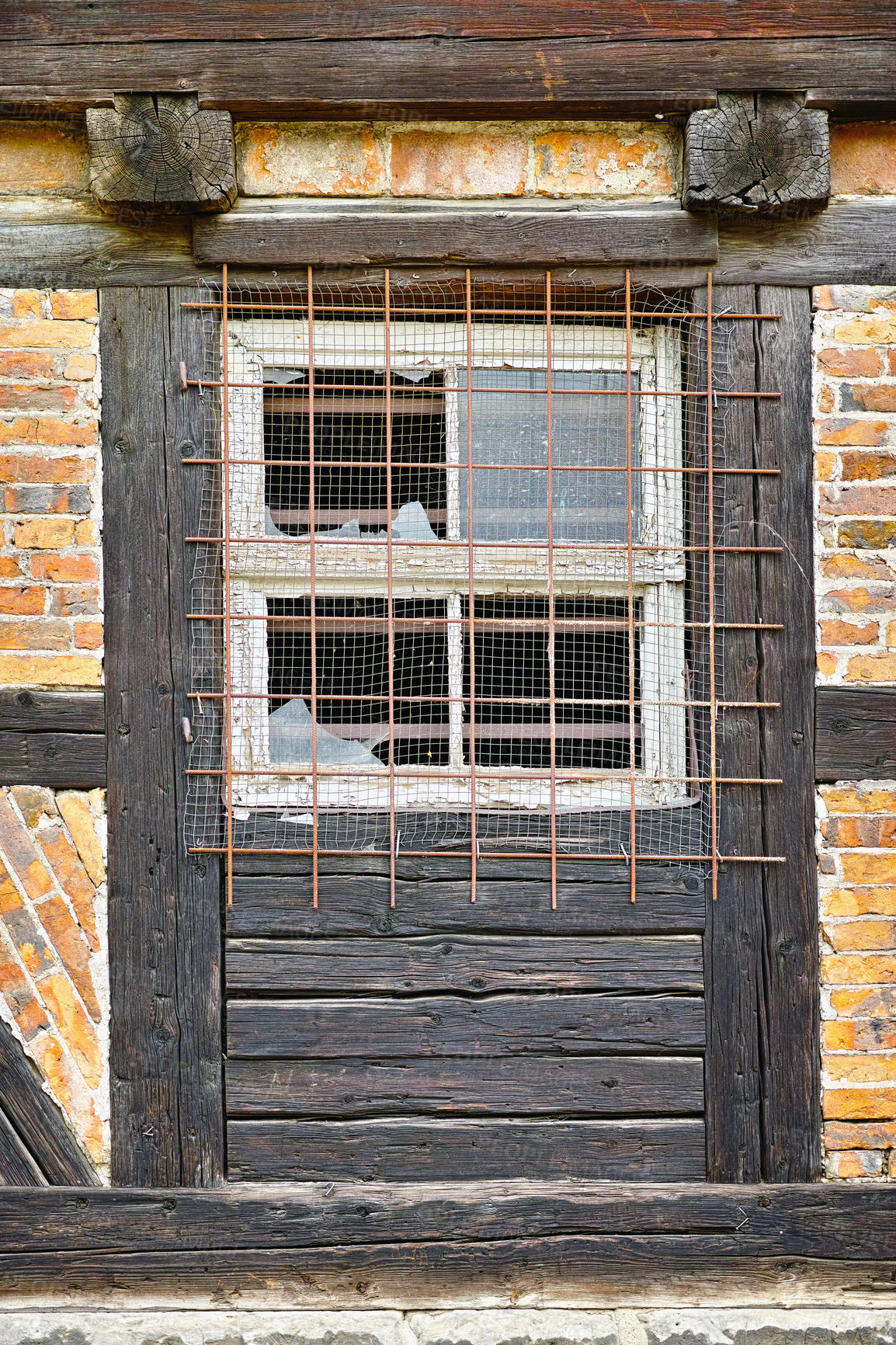 Buy stock photo Old, broken window and exterior with cage or brick wall of abandoned house, building or wooden frame. Historic outdoor bunker of rubble, glass crack or damage from war wreck, destruction or vandalism