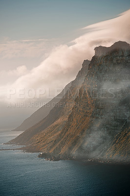 Buy stock photo Shot of the mountain meeting the ocean
