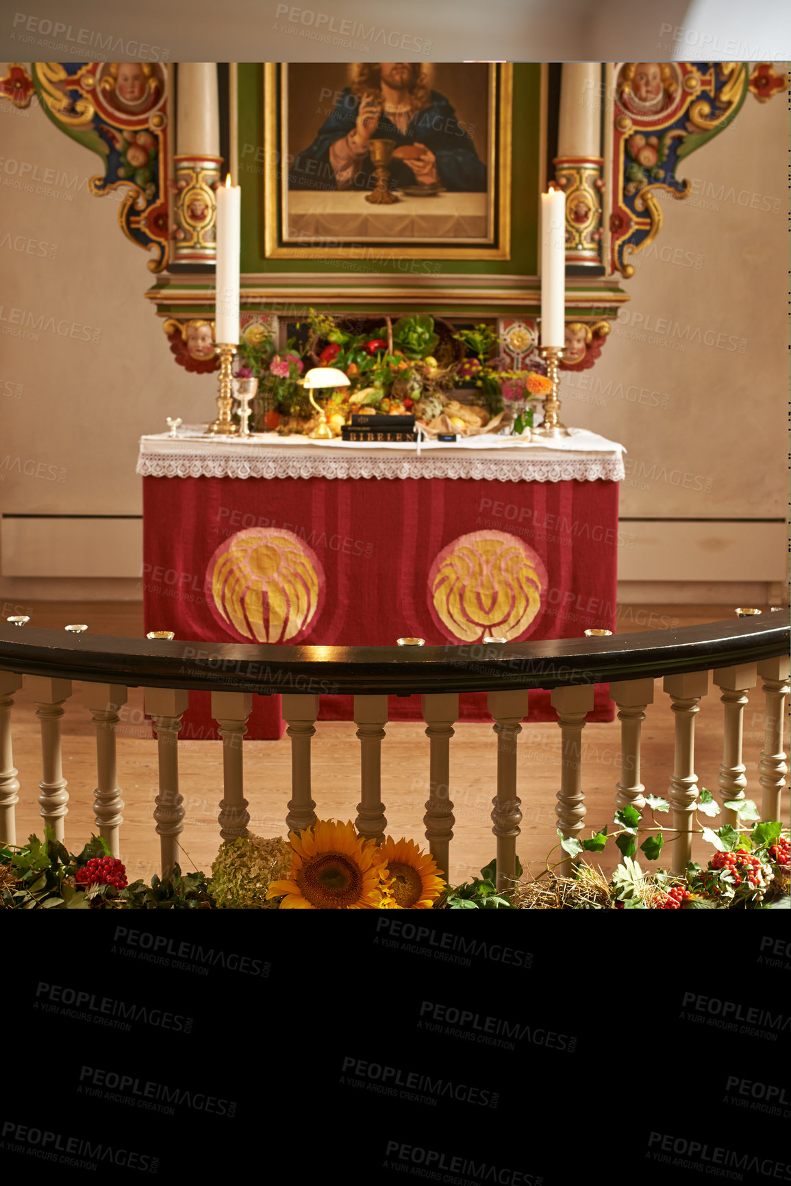 Buy stock photo Christian, shrine or altar in church for religion, worship and spiritual space for Catholic ceremony or culture. Praise, god and painting of Jesus in chapel with candles and holy bible on table