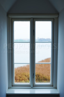 Buy stock photo A view through a window seen from inside