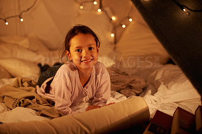 Buy stock photo Happy, portrait and girl in a bedroom fort in a house for holiday, games or staycation fun. Face, smile and happy kid in a diy tent for playing, resting or enjoy weekend with camping fantasy in house
