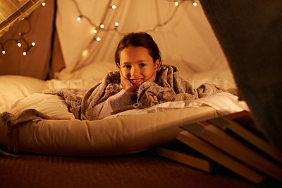 Buy stock photo Portrait, happy and girl in a bedroom fort in a house for holiday, games or staycation fun. Face, smile and happy kid in a diy tent for playing, resting or enjoy weekend with camping fantasy in house