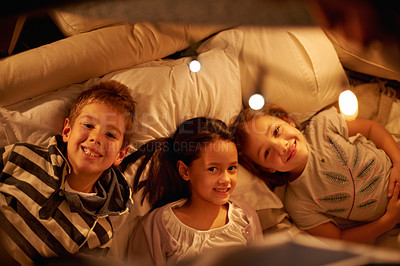 Buy stock photo Children, above and portrait of siblings in a bed with love, support and trust while bonding at home together. Family, night and face of kids in a bedroom for evening games, playing or indoor camping