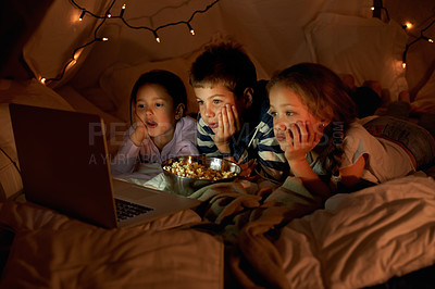 Buy stock photo Children, laptop and watch in tent at night with movies, film or cartoons for holiday adventure or vacation. Young boy, girl or kids with lights, pillows and blanket at home on computer for Netflix