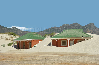 Buy stock photo Two cottages buried between the sand dunes in Hout Bay, South Africa