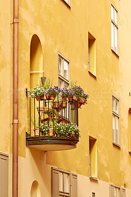 Buy stock photo A small flower-decorated balcony on an old building in Old town, Stockholm