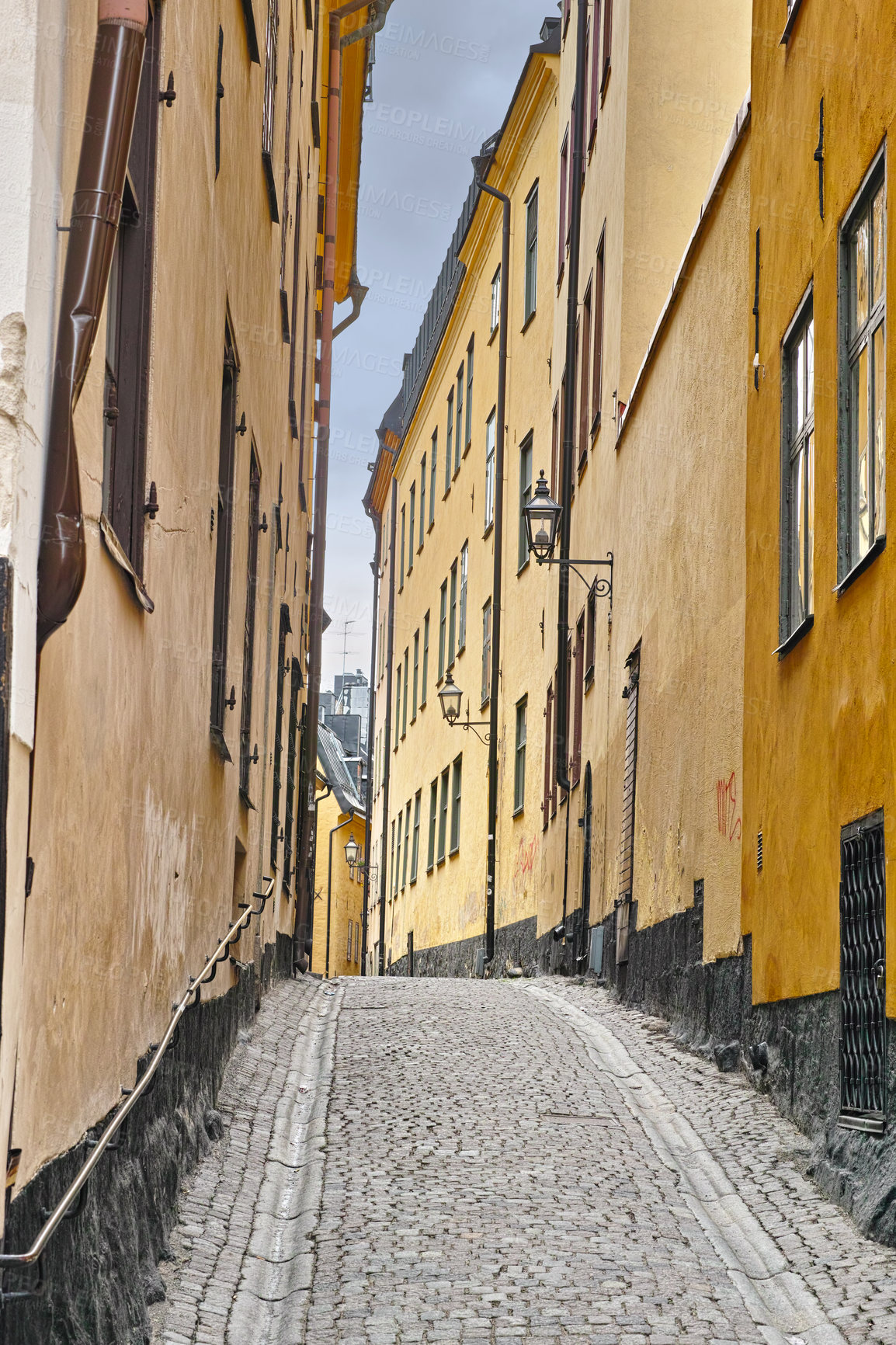 Buy stock photo Travel, architecture and street in vintage alley with history, culture or holiday destination in Sweden. Vacation, old buildings and antique stone road in Stockholm with cobble path in ancient city