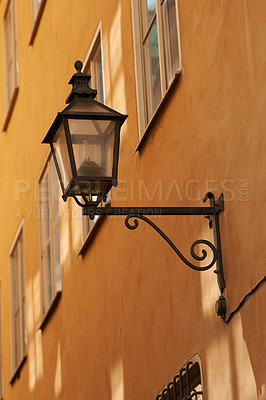 Buy stock photo Travel, wall and lantern on vintage building in old town with history, culture or holiday destination in Denmark. Vacation, architecture and antique lamp in Europe with retro light in ancient city