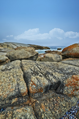 Buy stock photo Nature, blue sky and rocks by ocean in summer for travel destination, holiday and vacation. Natural background, landscape and waves, sea and water for scenic view in environment, ecosystem and island