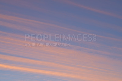 Buy stock photo View of clouds streaked across the sky at sunset with copyspace. Soft pastel lines of colour in nature, blue sky in the late afternoon. Zen, open clear sky offering a calm, gentle reminder to breathe