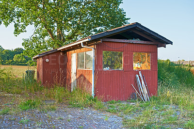 Buy stock photo Countryside, grass and field with broken cabin with vintage architecture on neighborhood in Texas. Ghost town,  countryside and house with rust in quiet community with nature and woods in village 