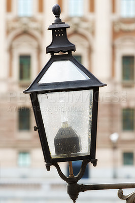 Buy stock photo Travel, architecture and lamp on vintage wall in old town with history, culture or holiday destination in Sweden. Vacation, landmark and antique lantern in Stockholm with retro light ancient city