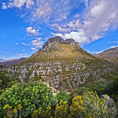 Buy stock photo Mountains, summer and blue sky with nature, clouds or stone with landscape or plants with sunshine. Empty, outdoor or grass with flowers or countryside with adventure or travel with vacation or earth