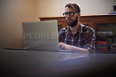 Buy stock photo Man, laptop and journalist with glasses in remote work, communication or networking at home. Male person, writer or freelancer working and typing on computer for online story or blog at the house