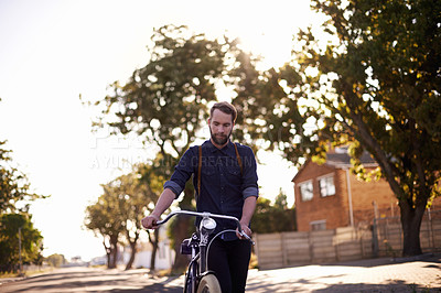 Buy stock photo Bicycle, transport and man in road walking with lens flare for exercise, commute and cycling in morning. Travel, city and male cyclist with bike for eco friendly traveling, carbon neutral and journey