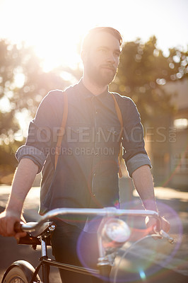 Buy stock photo Walking, transport and man in road with bicycle for exercise, commute and cycling in morning. Travel, lens flare and male cyclist with bike for eco friendly traveling, carbon footprint and journey
