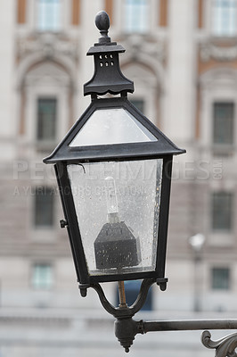 Buy stock photo Outdoor, lamp and street in city, vintage and retro for urban Cape Town to illuminate objects or areas. Winter, antique and light post for security in dark or night, alert and bulb in garden or park
