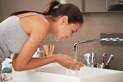 Buy stock photo Bathroom, washing face and woman with water for skincare, beauty and wellness in morning routine. Health, dermatology and happy person with liquid splash for cleaning, hygiene and grooming at home