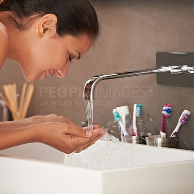 Buy stock photo Face, washing and woman with water in bathroom for skincare, beauty and wellness in morning routine. Health, dermatology and happy person with liquid splash for cleaning, hygiene and grooming at home