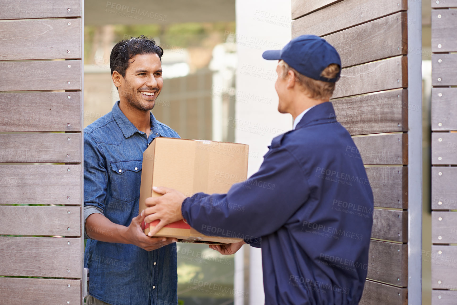 Buy stock photo Man, courier and home for giving package, ecommerce or delivery with smile, customer experience or outdoor. Logistics service, shipping and guy with gratitude, happy and receiving box at house door