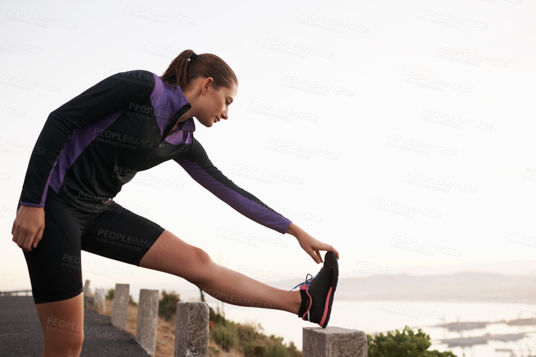 Buy stock photo Nature, stretching and woman on road for fitness, workout and commitment to healthy body. Exercise, wellness and girl runner in muscle warm up for outdoor marathon training, performance and morning.