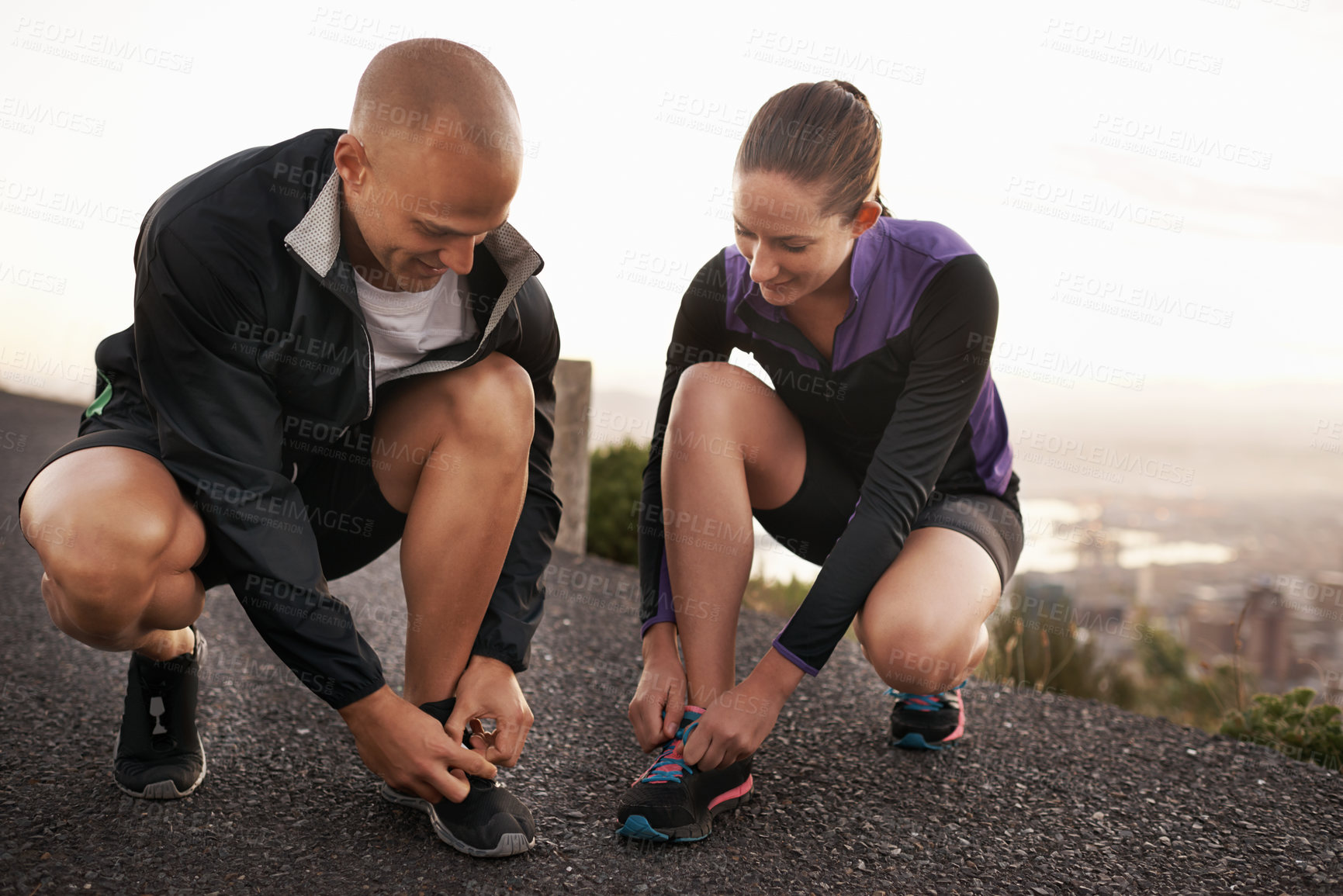 Buy stock photo Fitness, shoes and couple in a road for running, training or morning cardio run in nature together. Sneakers, shoelace and sports runner people outdoor for marathon, routine or performance workout