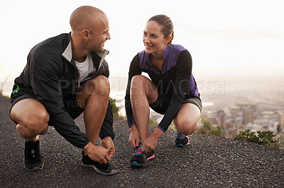 Buy stock photo Running shoes, love and couple in a road for fitness, training or morning cardio in nature together. Sneakers, shoelace and sports runner people outdoor for marathon, routine or performance workout