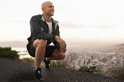 Buy stock photo Happy man, mountain and fitness with view of city for workout, exercise or training in nature. Young male person or athlete with smile for running, break or rest on road, street or outdoor cliff