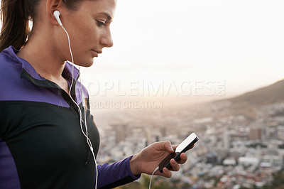 Buy stock photo Woman, fitness and earphones with phone for music, podcast or listening to audio on mountain in nature. Female person or runner with headphones for streaming, sound or radio player during exercise