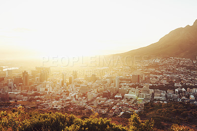 Buy stock photo Sun, top view of city with landscape and mountains, buildings and architecture with nature outdoor. Flare, natural light and urban development background for property, horizon or skyline with travel