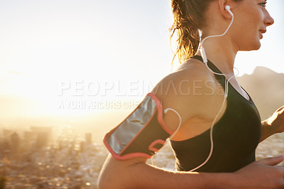 Buy stock photo Woman, running and listening to music with earphones for workout, training or outdoor exercise. Young female person or runner with smile and headphones for audio streaming or cardio on mockup space