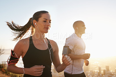 Buy stock photo Sunrise, streaming and fitness couple running as workout or morning exercise for health and wellness together. Sport, marathon and woman runner run with man athlete for training for sports or energy