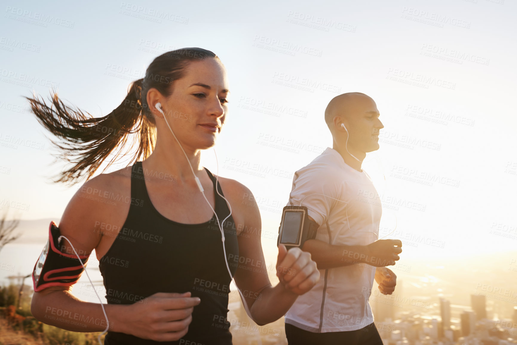 Buy stock photo Sunrise, streaming and fitness couple running as workout or morning exercise for health and wellness together. Sport, marathon and woman runner run with man athlete for training for sports or energy