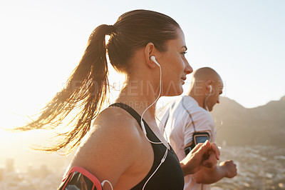 Buy stock photo Streaming, fitness and running couple doing exercise or morning workout for health and wellness together. Sport, man and woman runner run with athlete while training and listening to sports music