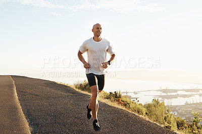Buy stock photo Fitness, running and man on road in mountain for health, wellness and strong body development. Workout, exercise and runner on path in nature for marathon training, performance and challenge on hill.