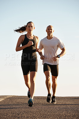 Buy stock photo Full length shot of two young runners training outdoors