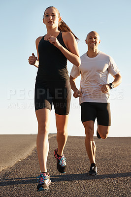 Buy stock photo Road, training and personal trainer running with woman as workout or morning exercise for health and wellness. Sport, man and street runner with athlete as fitness for a marathon, sports and energy