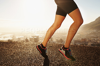 Buy stock photo Legs, shoes and person running in city, cardio and fitness for health and wellness at sunrise. Athlete, marathon and speed with runner on road outdoor for exercise, workout and training in morning