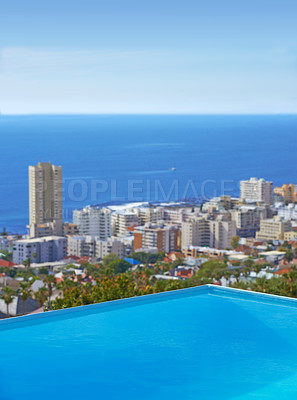 Buy stock photo Pool, city building and ocean outdoor for travel destination in summer for hotel swimming, infrastructure or downtown. Skyline, water and lodge accommodation in Cape Town or relax, trip or vacation
