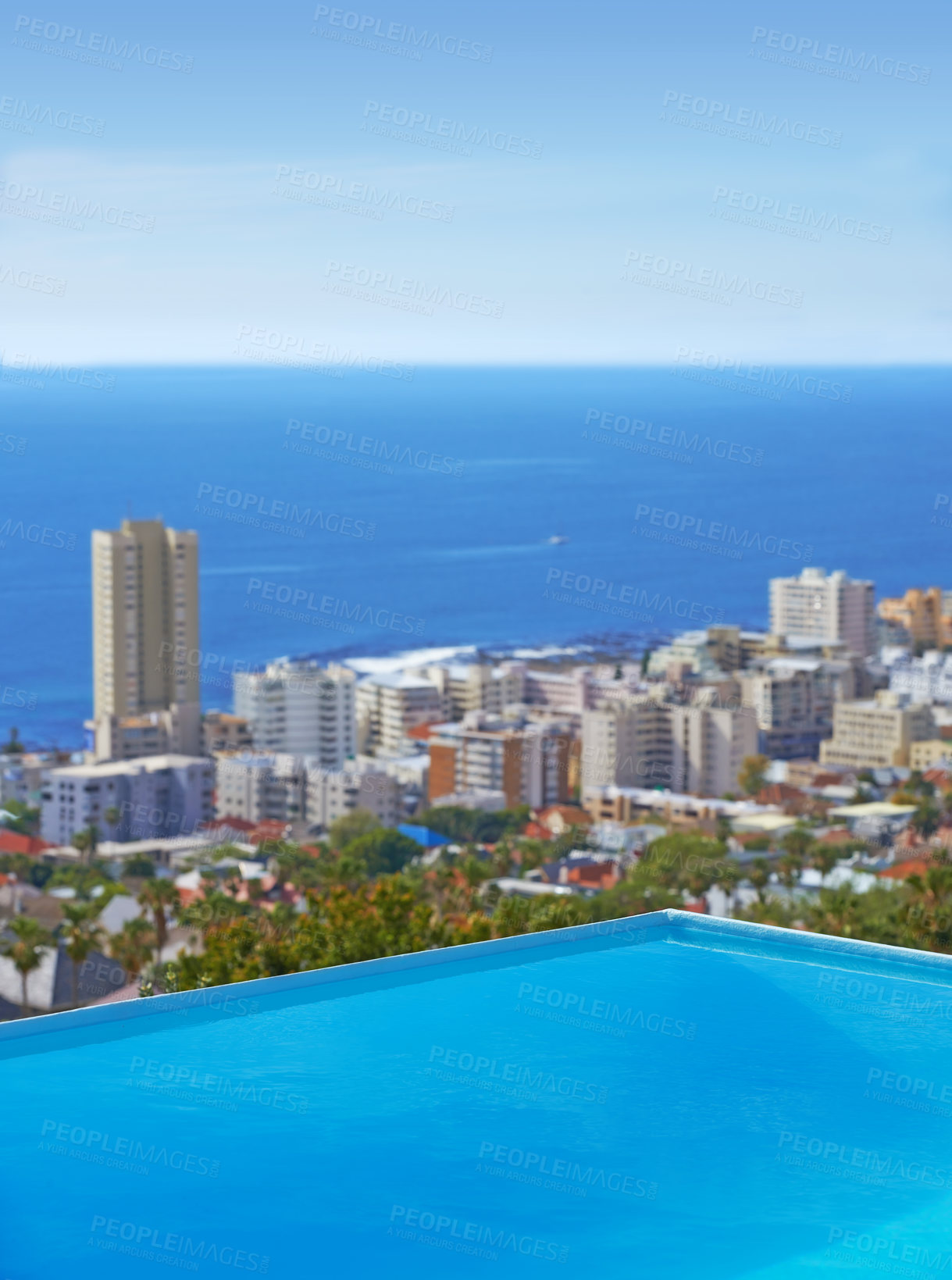 Buy stock photo Pool, city building and ocean outdoor for travel destination in summer for hotel swimming, infrastructure or downtown. Skyline, water and lodge accommodation in Cape Town or relax, trip or vacation