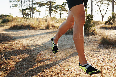 Buy stock photo Legs, running and person in park for fitness, cardio and health outdoor for training and wellness. Athlete, speed and action with runner on dirt path for race, workout and exercise with endurance