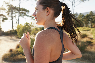 Buy stock photo Fitness, running and woman on road in forest for health, wellness and strong body development. Workout, exercise and girl runner on path in nature for marathon training, performance and challenge.