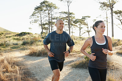 Buy stock photo Forest, fitness and running couple training, workout and doing morning exercise for health and wellness together. Sport, man and woman runner run with athlete on a mountain for sports or energy