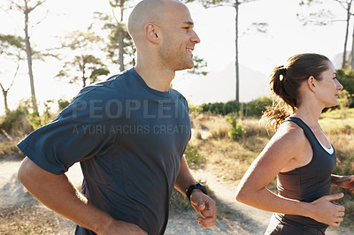 Buy stock photo Forest, fitness and coach running with woman as a workout or morning exercise for health and wellness together. Sport, man and runner with athlete as training in nature for sports run energy